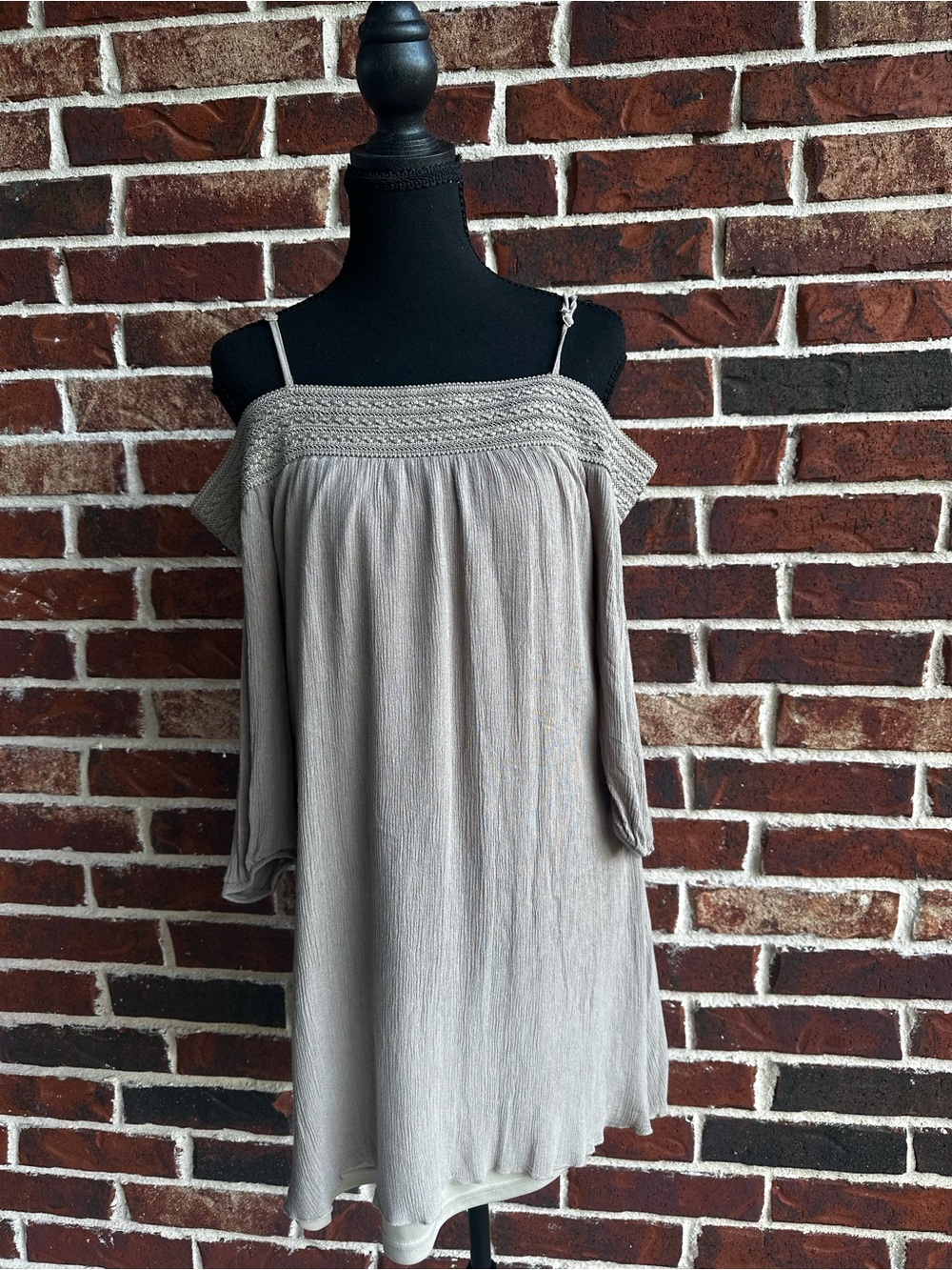 neutral knit top with cold-shoulder detail